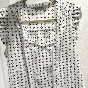 Black and white sleeveless blouse/ Jon and Anna contemporary